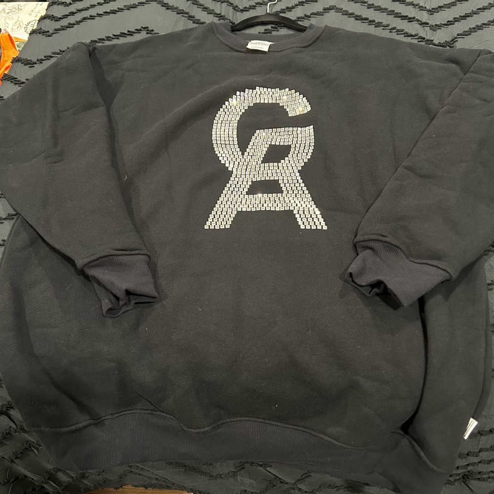 Black sweatshirt long with sequins on the front. Size Large